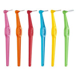 Six colorful interdental brushes in pink, orange, red, blue, yellow, and green for oral hygiene.