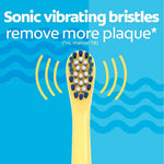 Yellow electric toothbrush head with sonic vibrating bristles for plaque removal.