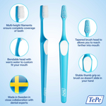 TePe blue toothbrush featuring multi-height filaments, tapered head, and bendable design.