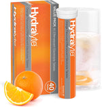 Hydralyte orange flavoured effervescent electrolyte tablets in a box and tube with a glass of water.