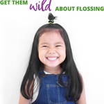 Smiling young girl with long dark hair promoting healthy dental hygiene and flossing habits.