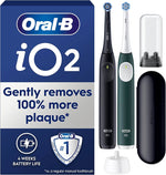 Oral-B iO2 electric toothbrush set with black and green models, charging case, and brush head.