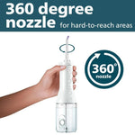 Hand holding a white cordless water flosser with a 360 degree rotating nozzle for oral hygiene.