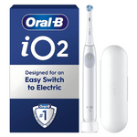 Oral-B iO2 electric toothbrush with charging base and white travel case.