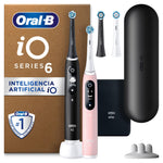 Oral-B iO Series 6 electric toothbrush set with black and pink handles and charging case.