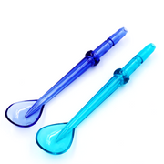 Two translucent blue and turquoise plastic oral hygiene irrigation tips on white background.