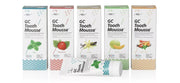 Assorted GC Tooth Mousse topical cream flavors including Mint, Strawberry, Vanilla, Melon, and Tutti-Frutti.