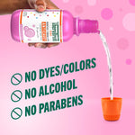 Pouring bubblegum flavored kids oral rinse into a small orange cup, free from dyes and alcohol.