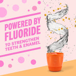 Splash of water with stars and text about fluoride for strengthening teeth and enamel.