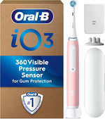 Oral-B iO3 electric toothbrush with pink handle, charging base, and travel case.