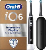 Oral-B iO6 electric toothbrush set with interactive display, charging base, and travel case.