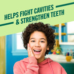 Smiling child with healthy teeth and a bright smile, promoting oral hygiene and cavity prevention.