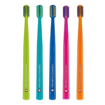 Five colorful Curaprox CS 5460 ortho toothbrushes in lime, teal, blue, pink, and orange.