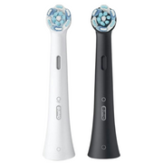 White and black Oral-B iO electric toothbrush replacement heads for oral hygiene.