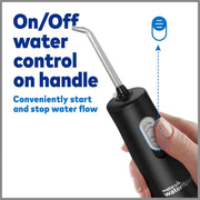 Hand holding a black water flosser with an on/off water control button on the handle.