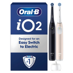 Oral-B iO2 electric toothbrush set with black and rose gold handles and charging base.