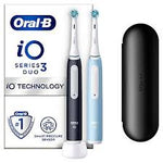 Oral-B iO Series 3 Duo electric toothbrushes with charging base and travel case.