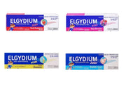 Four boxes of Elgydium kids and junior toothpaste gel in strawberry, berry, banana, and bubble gum flavors.
