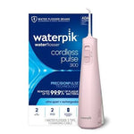 Waterpik Cordless Pulse 3100 pink rechargeable water flosser with packaging.